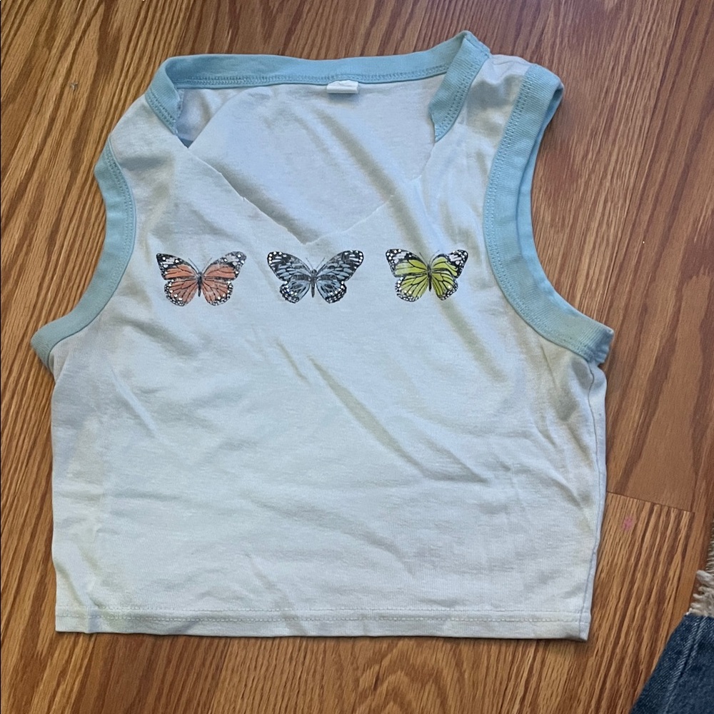 cute white crop top with butterfly’s